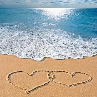 Love hearts drawn in the sand on Daytona Beach at Emerald Shores Hotel