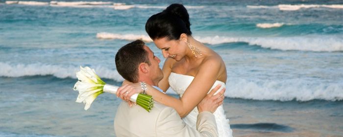 A couple celebrates after a beautiful oceanfront wedding in Daytona Beach